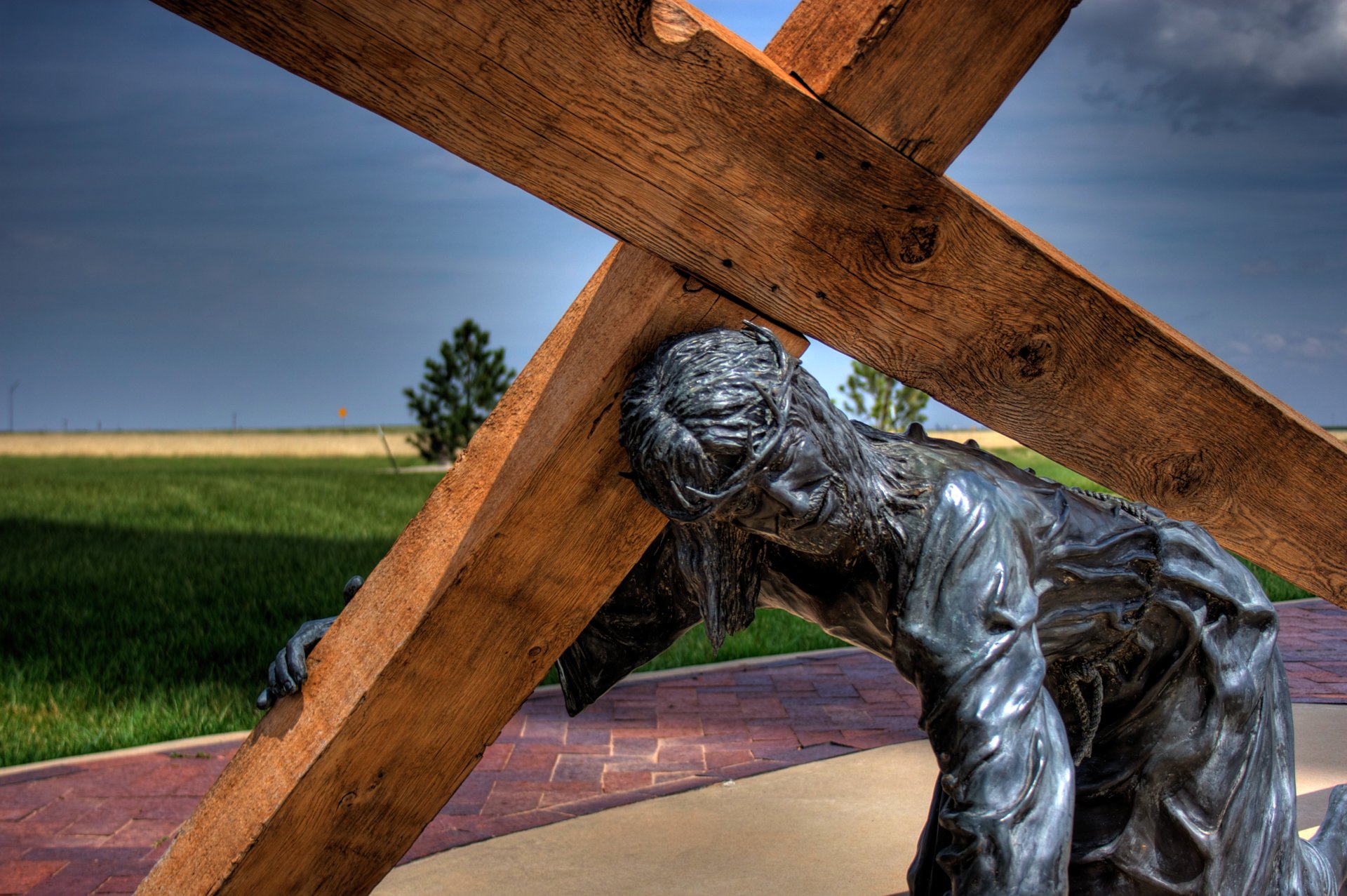 Statue of Jesus carrying a wooden cross