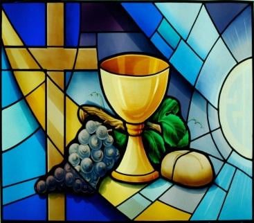 Artist's Stained glass depiction of a cross, chalice, grapes and loaf of bread