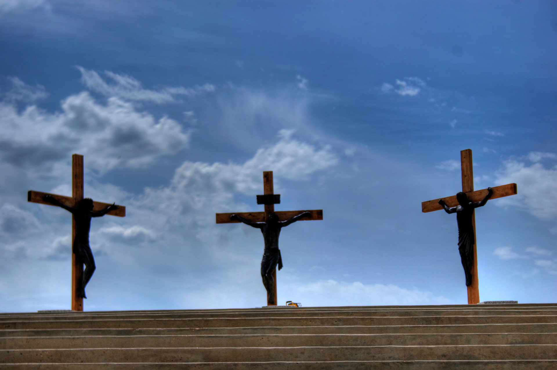 Statues erected outside of 3 crosses with Jesus in the middle and the 2 thieves on each side