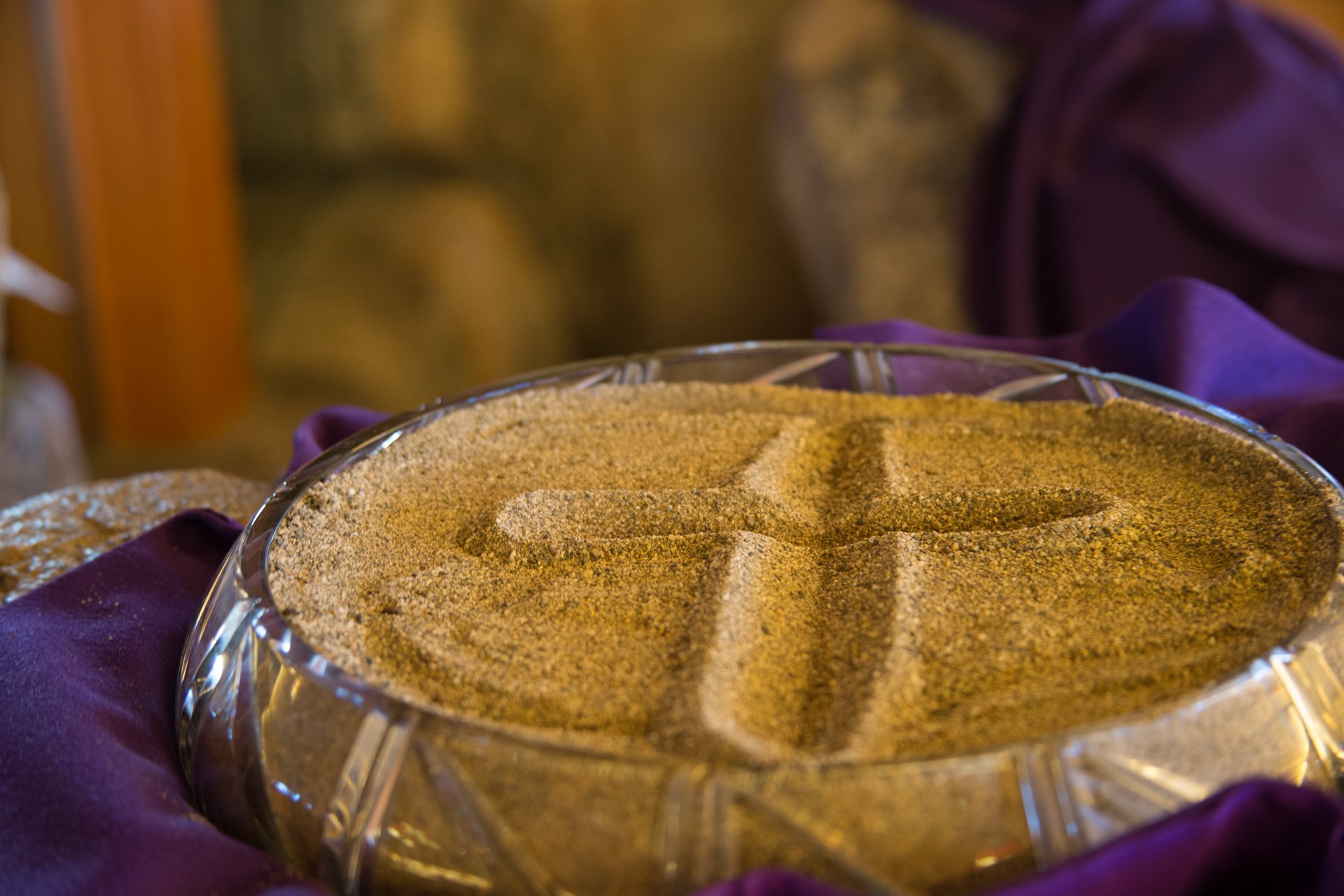 Bowl of ashes with a cross drawn in it