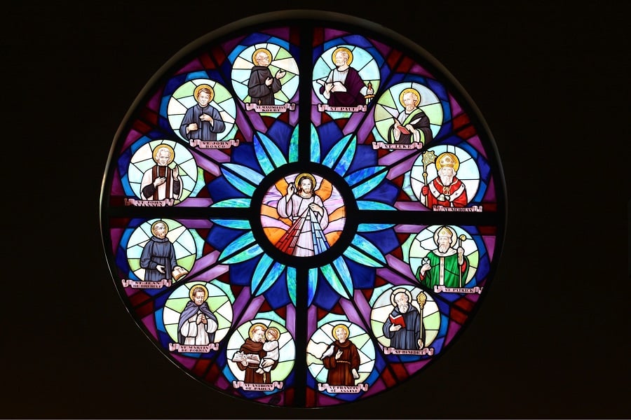 Stained Glass window in St. Leonard's Parish with the Jesus the Divine Mercy in the center surrounded by 12 male saints