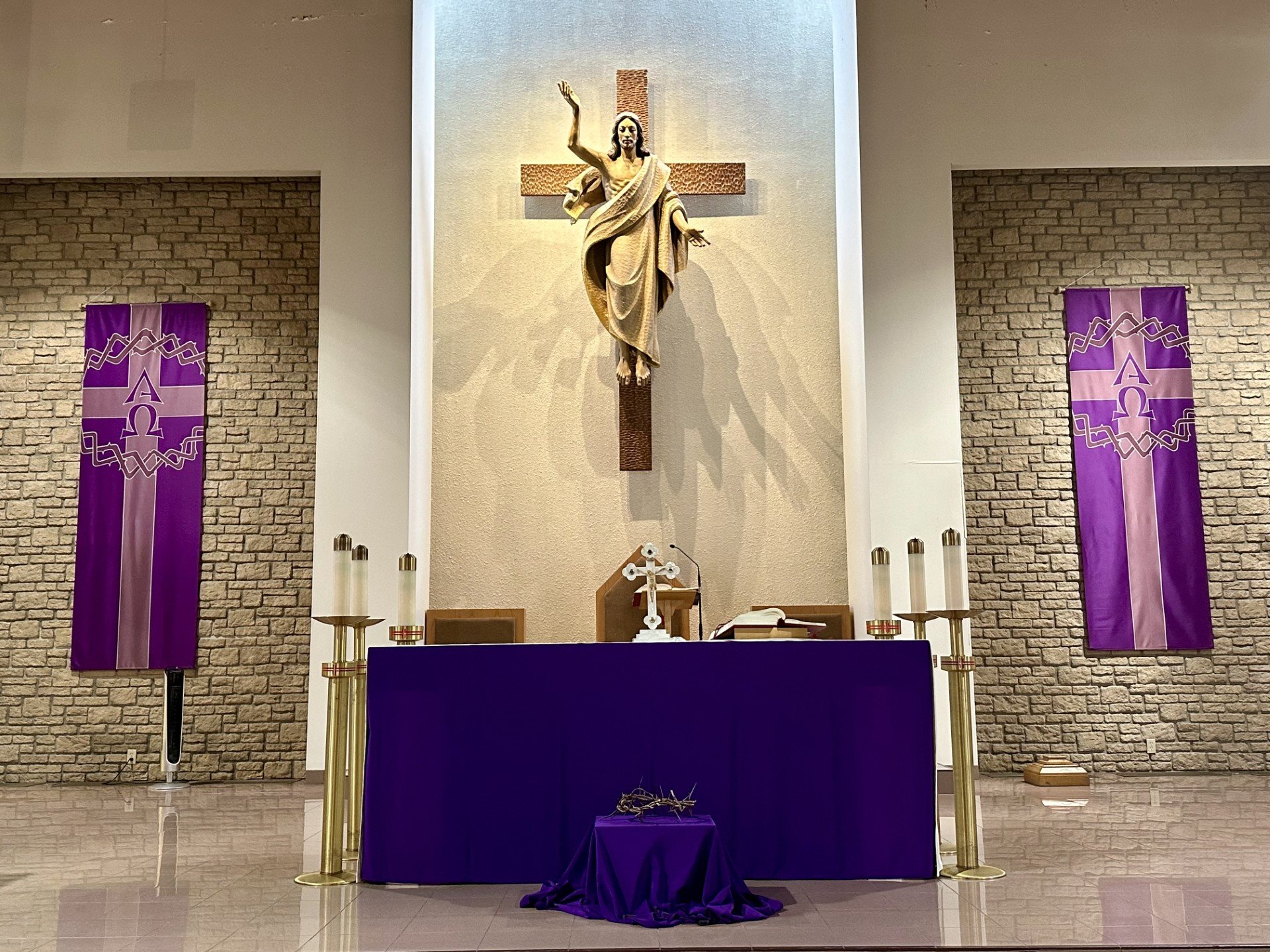 St. Leonard's Altar with purple cloth covering the altar and purple banners at each side